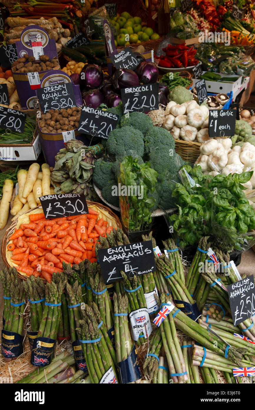 Close up of vegetables on a market stall, priced in pounds sterling. Stock Photo