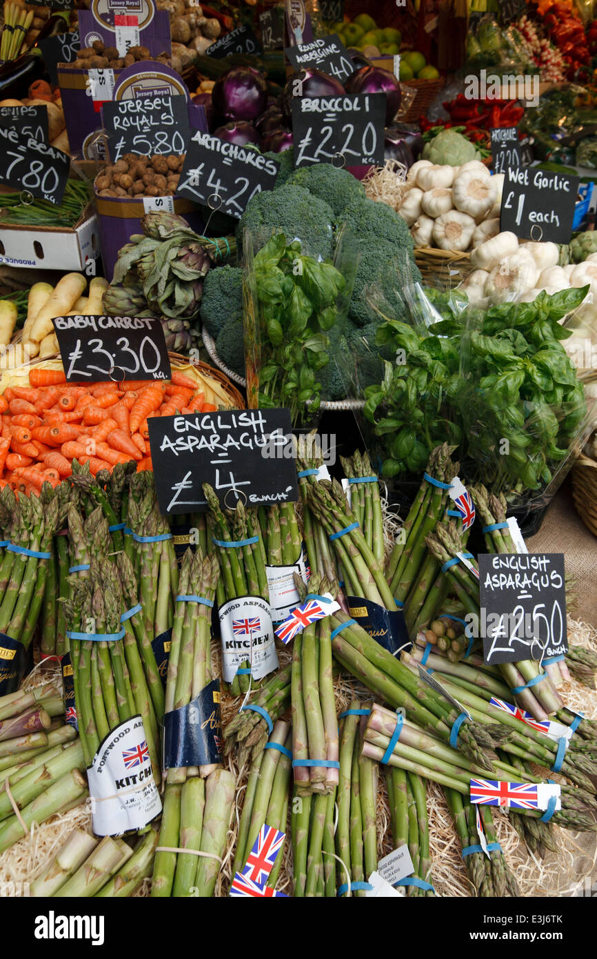 Close up of vegetables on a market stall, priced in pounds sterling. Stock Photo