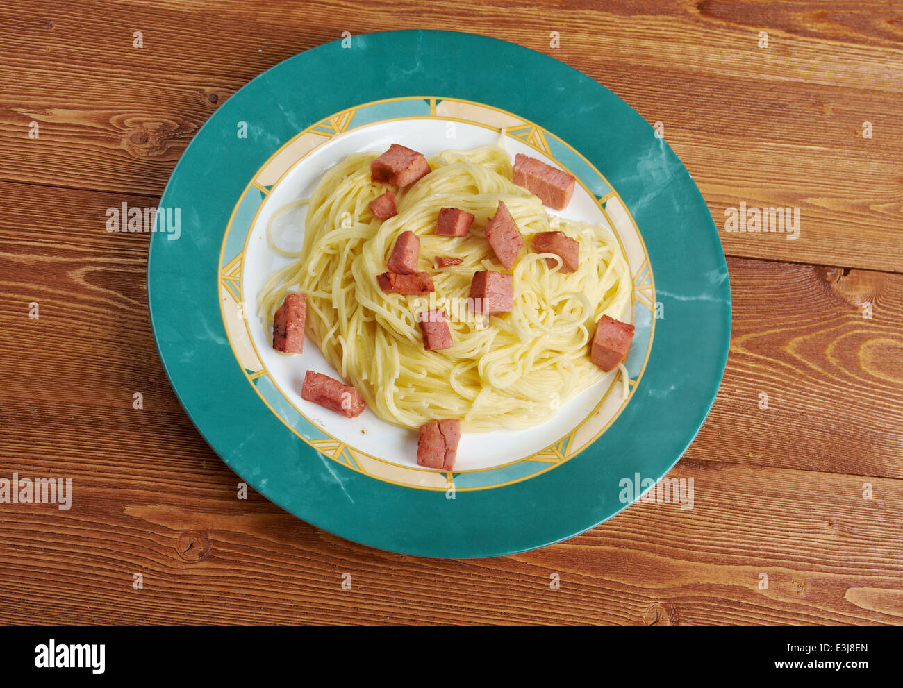 Capellini pasta with cream sauce Alfredo and sausage Stock Photo Alamy