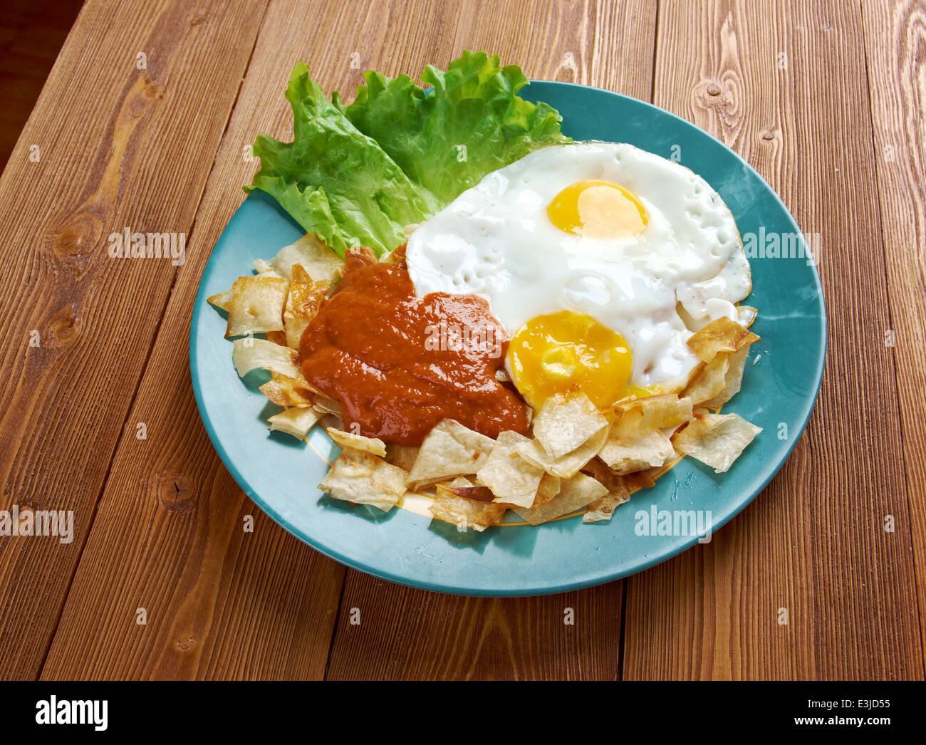 Huevos con chilaquiles Mexican traditional breakfast eggs. Eggs with