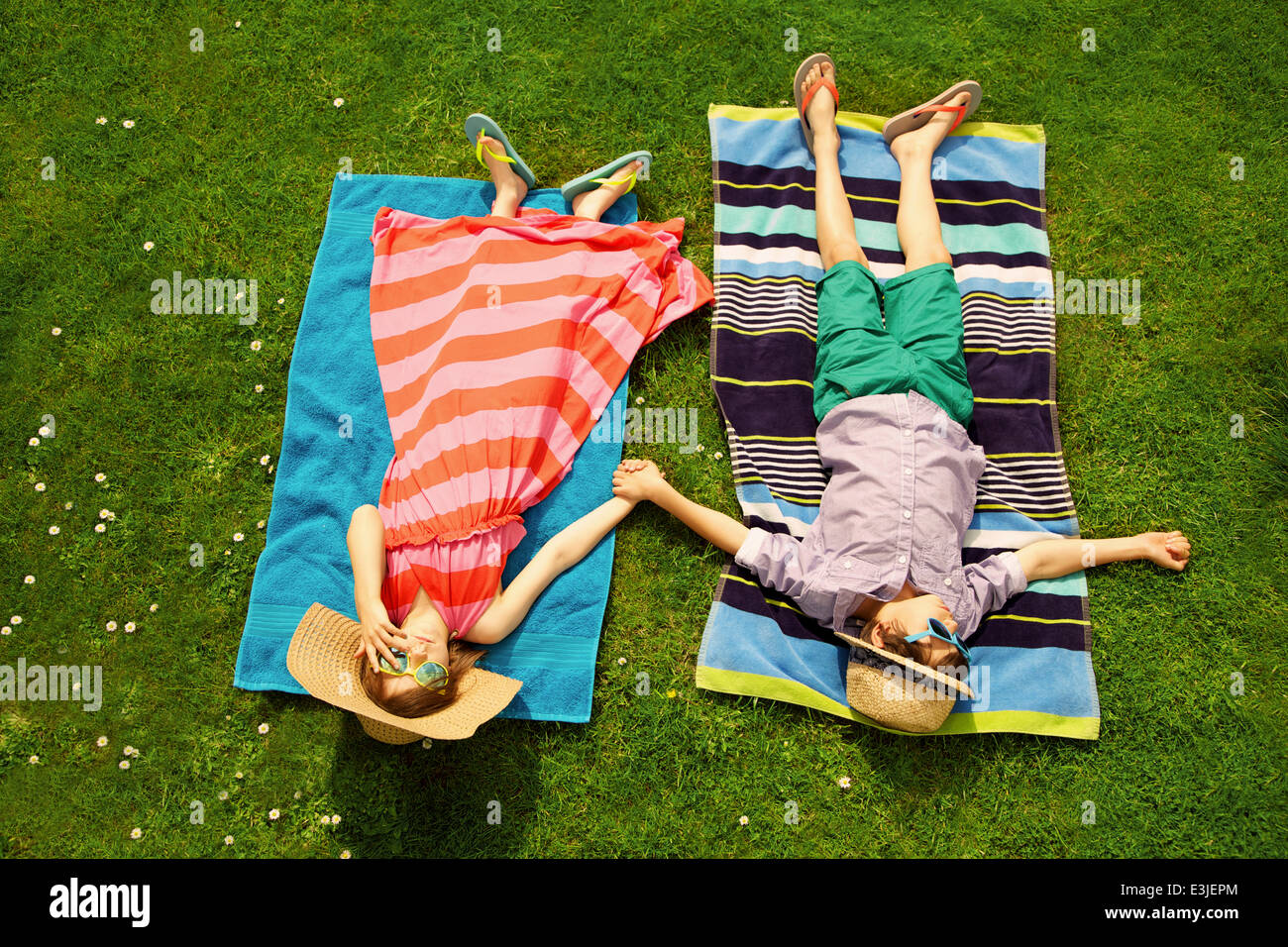Young boy sunbathing on lawn hires stock photography and images Alamy