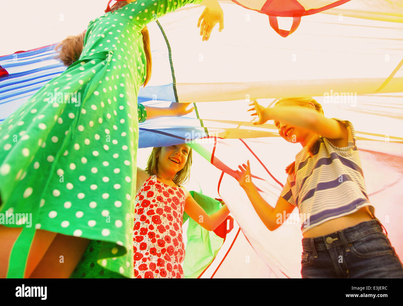 Children playing parachute hi-res stock photography and images - Alamy