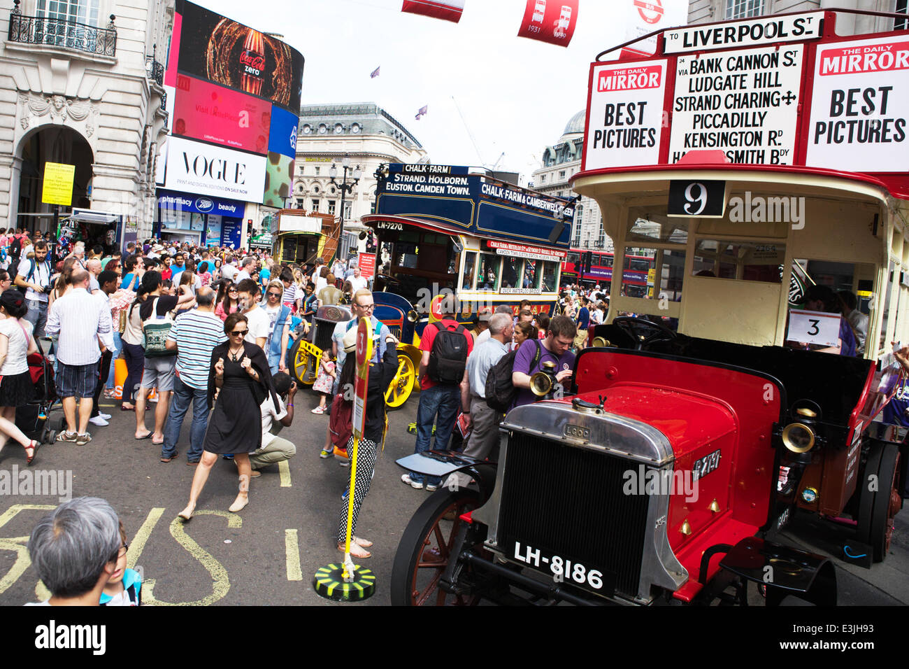 Regent Street, London, UK, 22nd June 2014. 2014 is the Year of the Bus: to celebrate this, Regent Street became traffic free and hosted iconic buses used in London from 1829 to present day.  Classic London open top buses. advertising and crowds of people. Credit:  Tony Farrugia/Alamy Live News Stock Photo