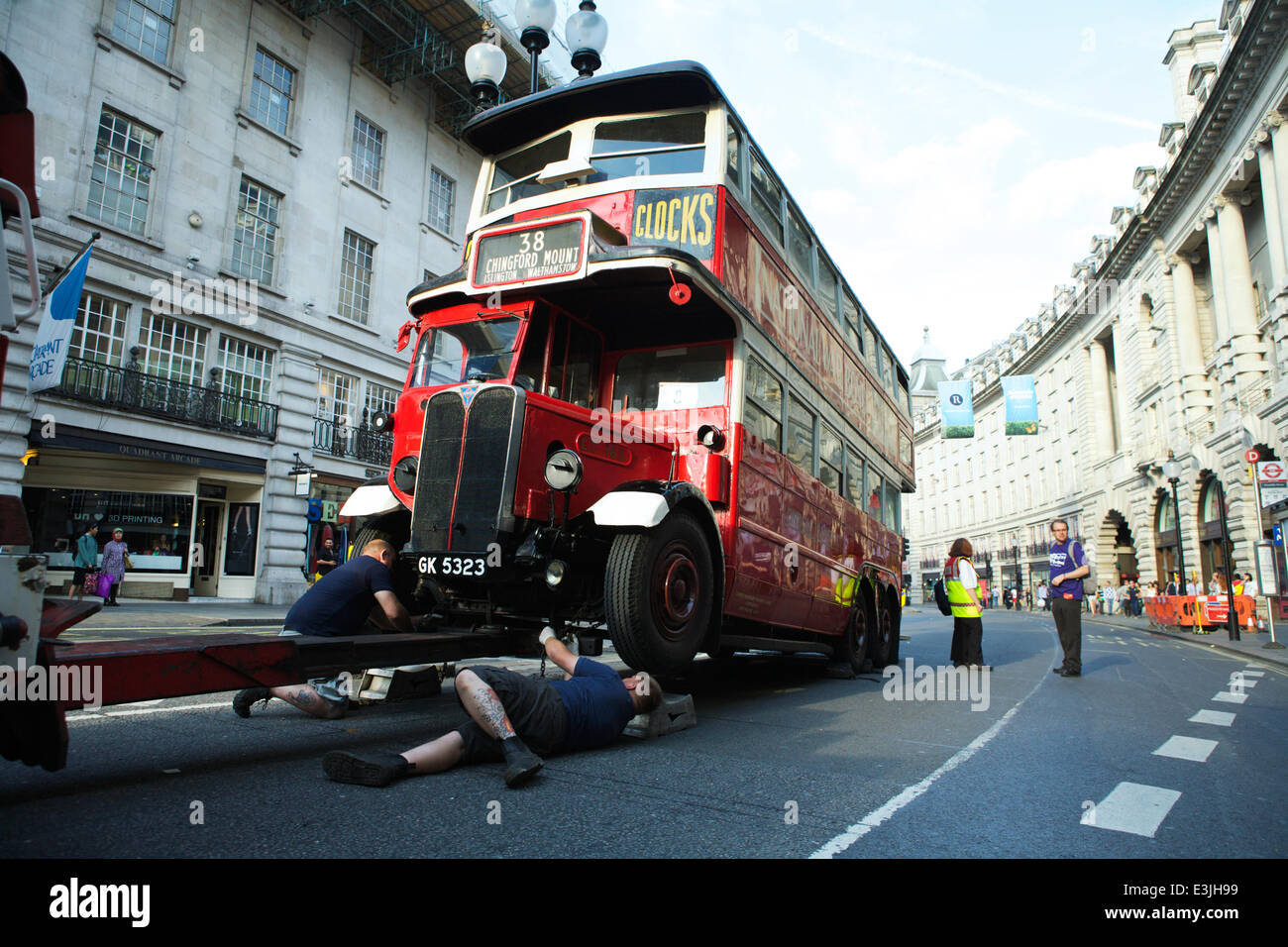 Regent Street, London, UK, 22nd June 2014. 2014 is the Year of the Bus: to celebrate this, Regent Street became traffic free and hosted iconic buses used in London from 1829 to present day. London bus broken down. Historic red London bus. Credit:  Alamy Live News Stock Photo