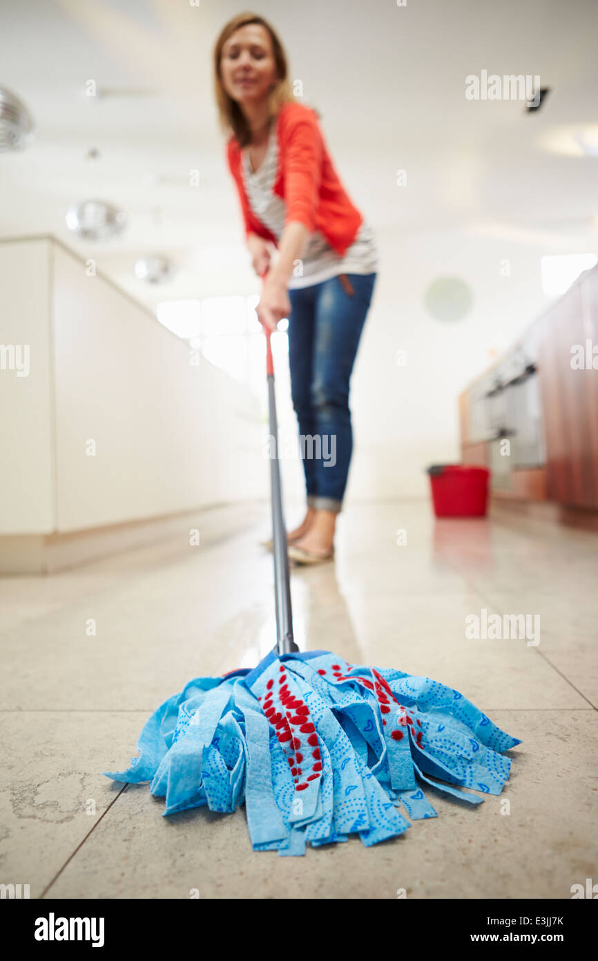 Woman Mopping Kitchen Floor Stock Photo Alamy
