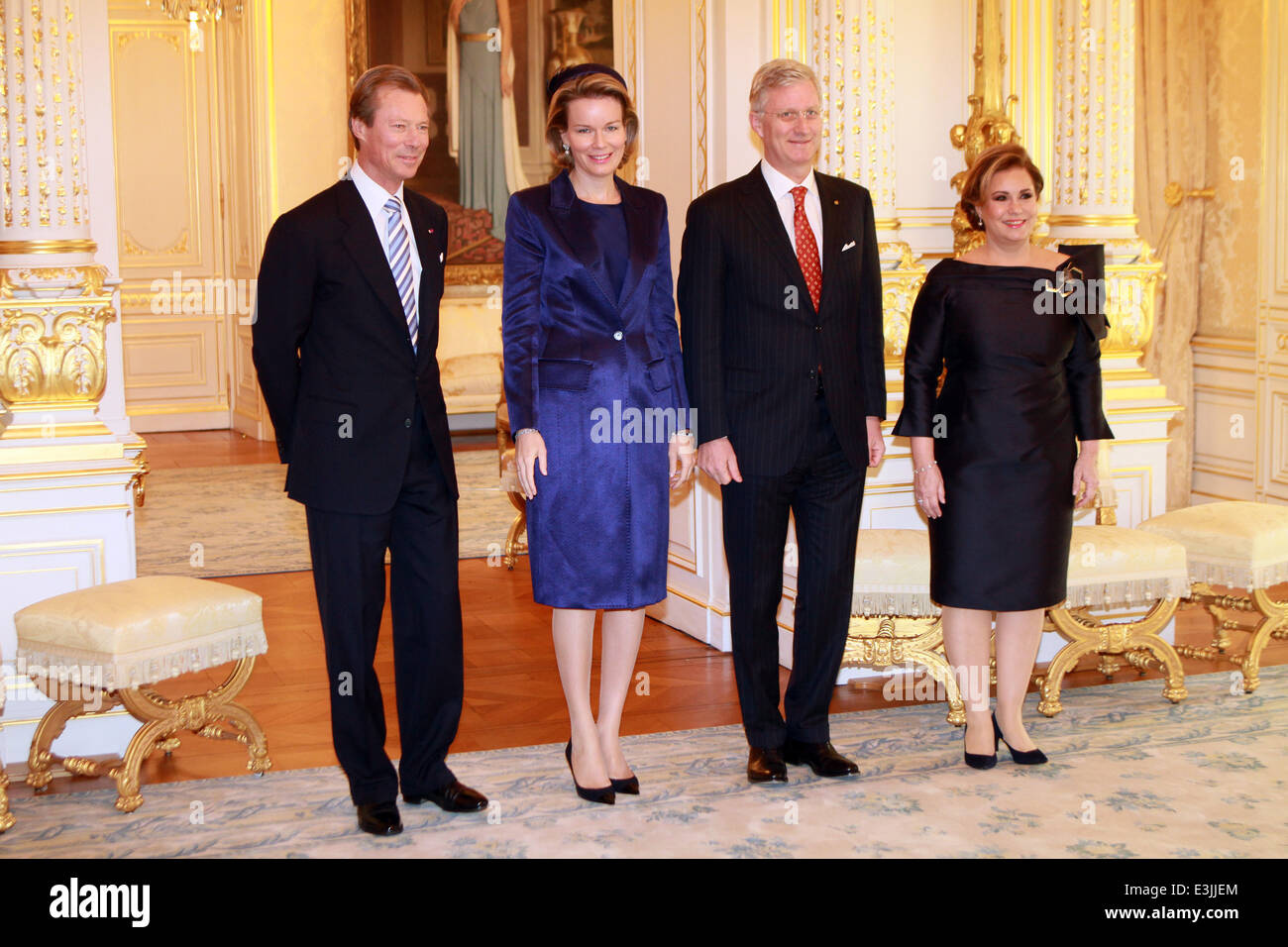 The Belgian royals attend a welcome ceremony hosted by Grand Duke Henri and Grand Duchess Maria Teresa of Luxembourg at Grand Ducal Palace in Luxembourg City. King Philippe and Queen Mathilde of Belgium, accompanied by Belgian Prime Minister Elio Di Rupo Stock Photo