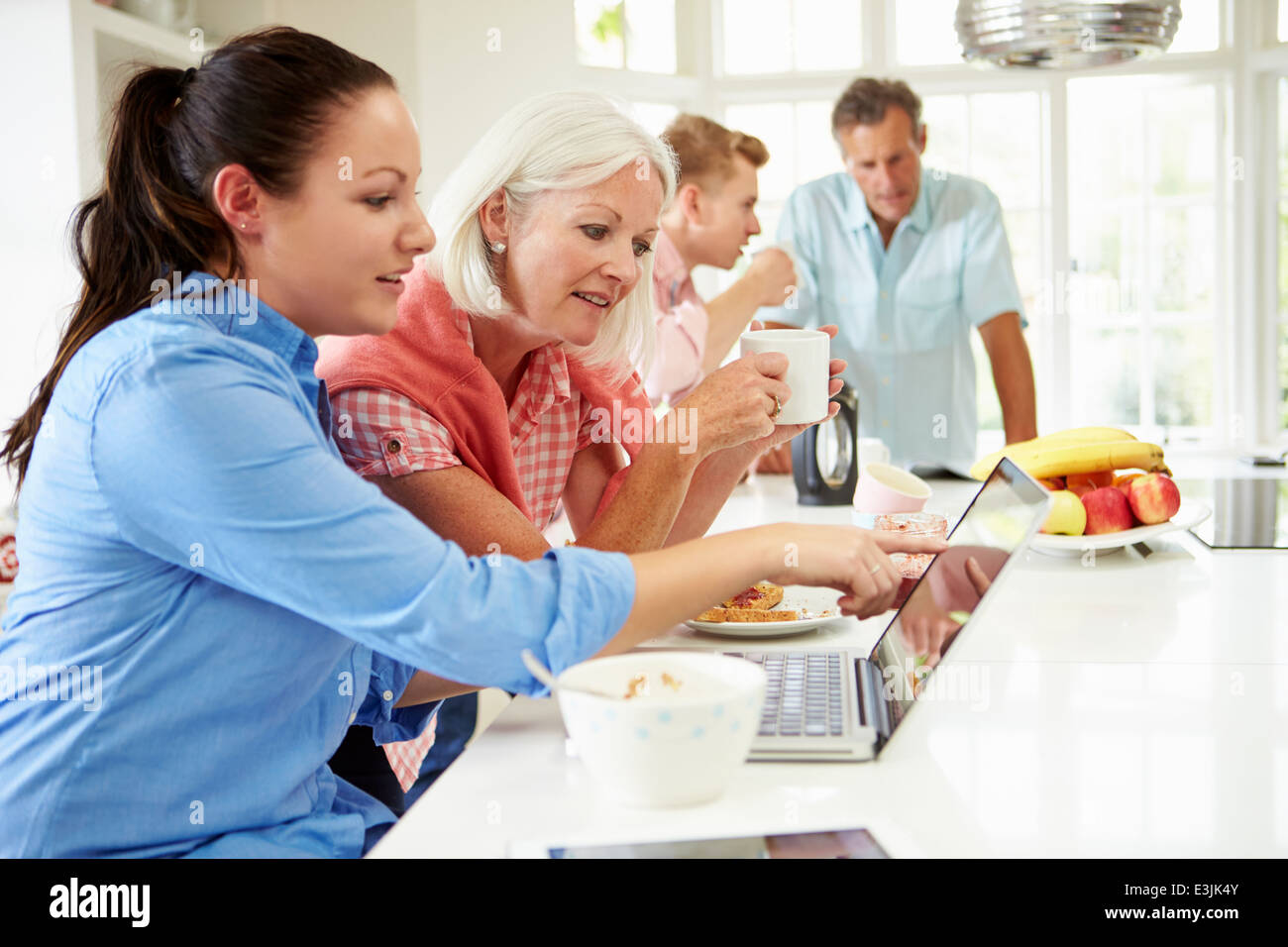 Family With Adult Children Having Breakfast Together Stock Photo