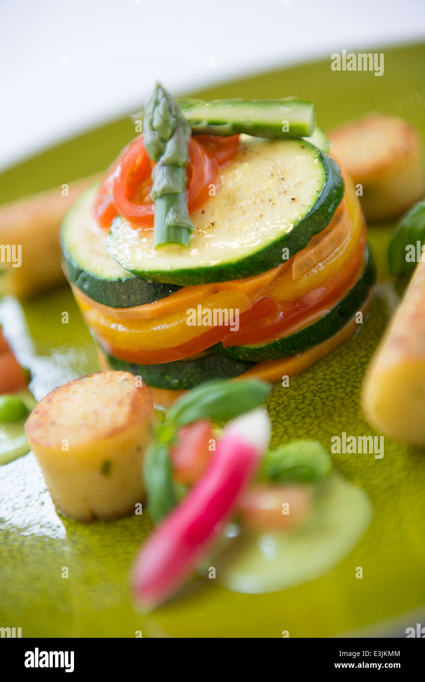 Mediterranean vegetable stack served in a fine dining restaurant with