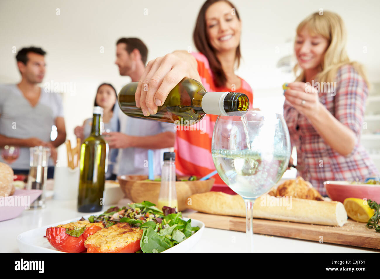 Group Of Friends Having Dinner Party At Home Stock Photo