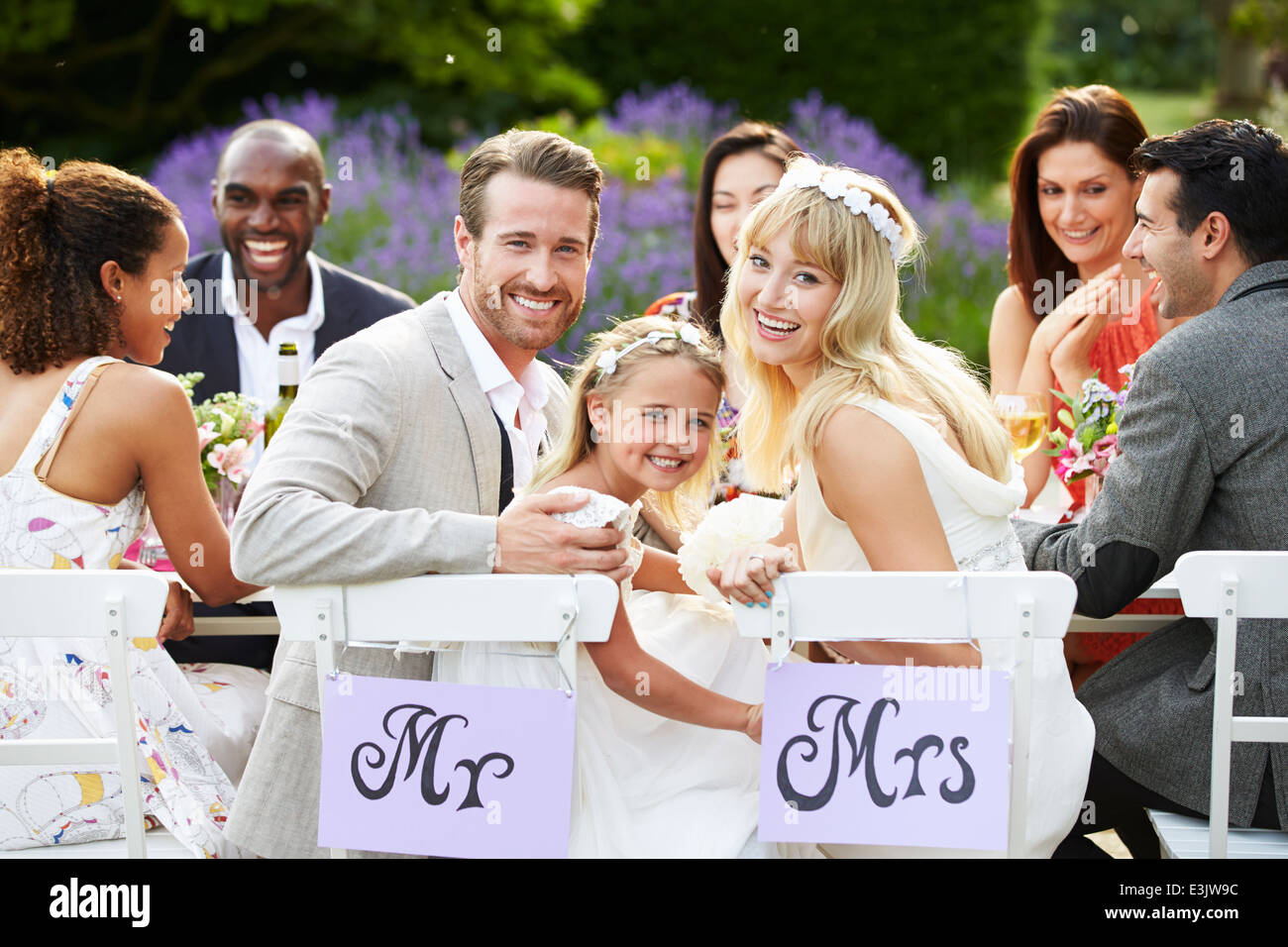 Bride And Groom With Bridesmaid At Wedding Reception Stock Photo - Alamy
