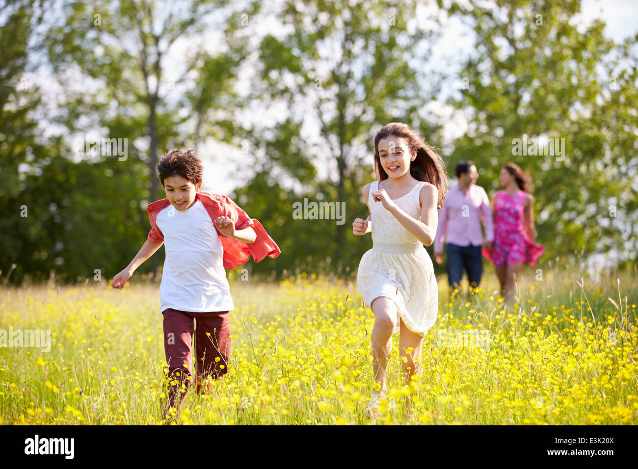 Hispanic Family Walking In Countryside Stock Photo