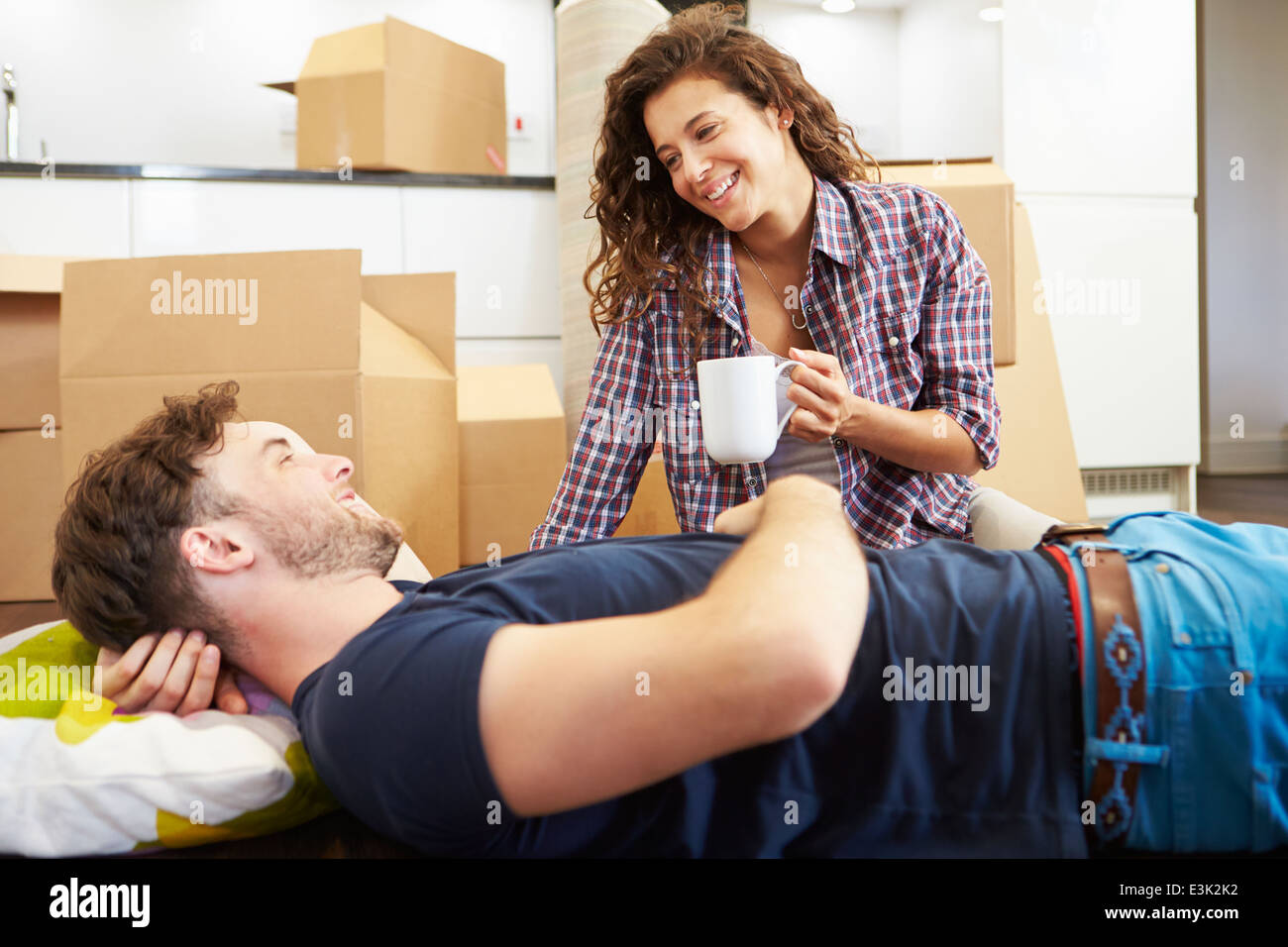 Couple Taking A Break During House Move Stock Photo