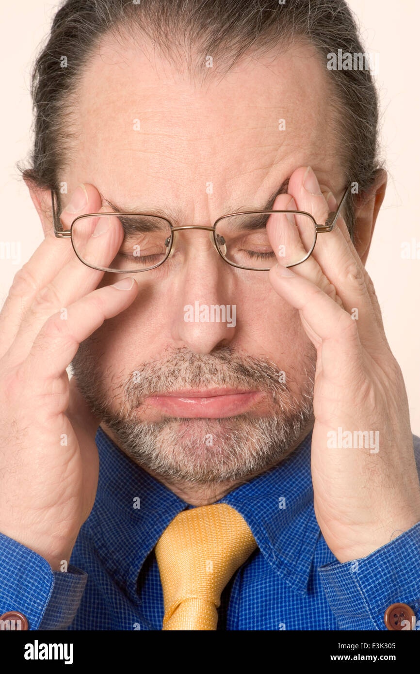 Man with eyes closed sighing, portrait, close up Stock Photo