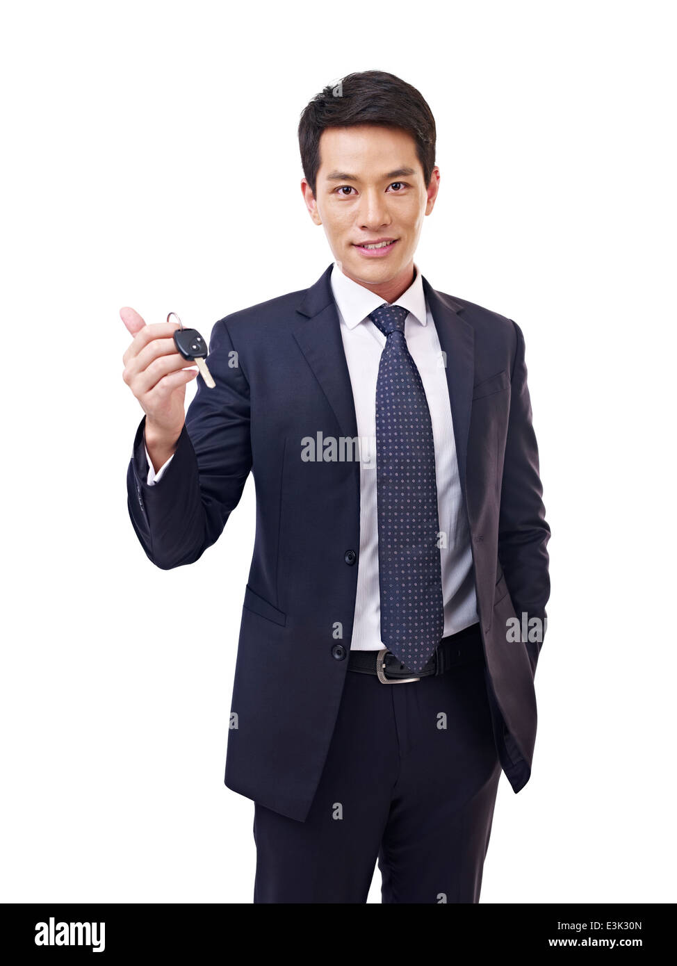 young asian car salesman holding car key Stock Photo