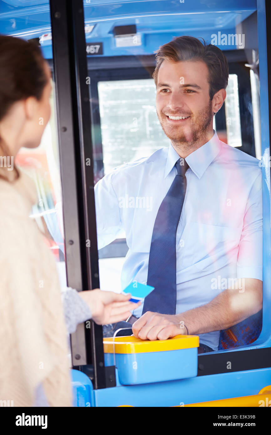 Woman Boarding Bus And Using Pass Stock Photo Alamy