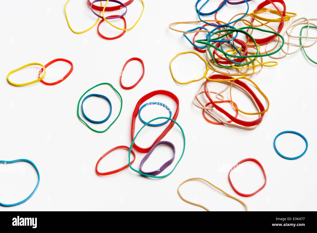 Collage of colorful rubber bands on white background Stock Photo - Alamy
