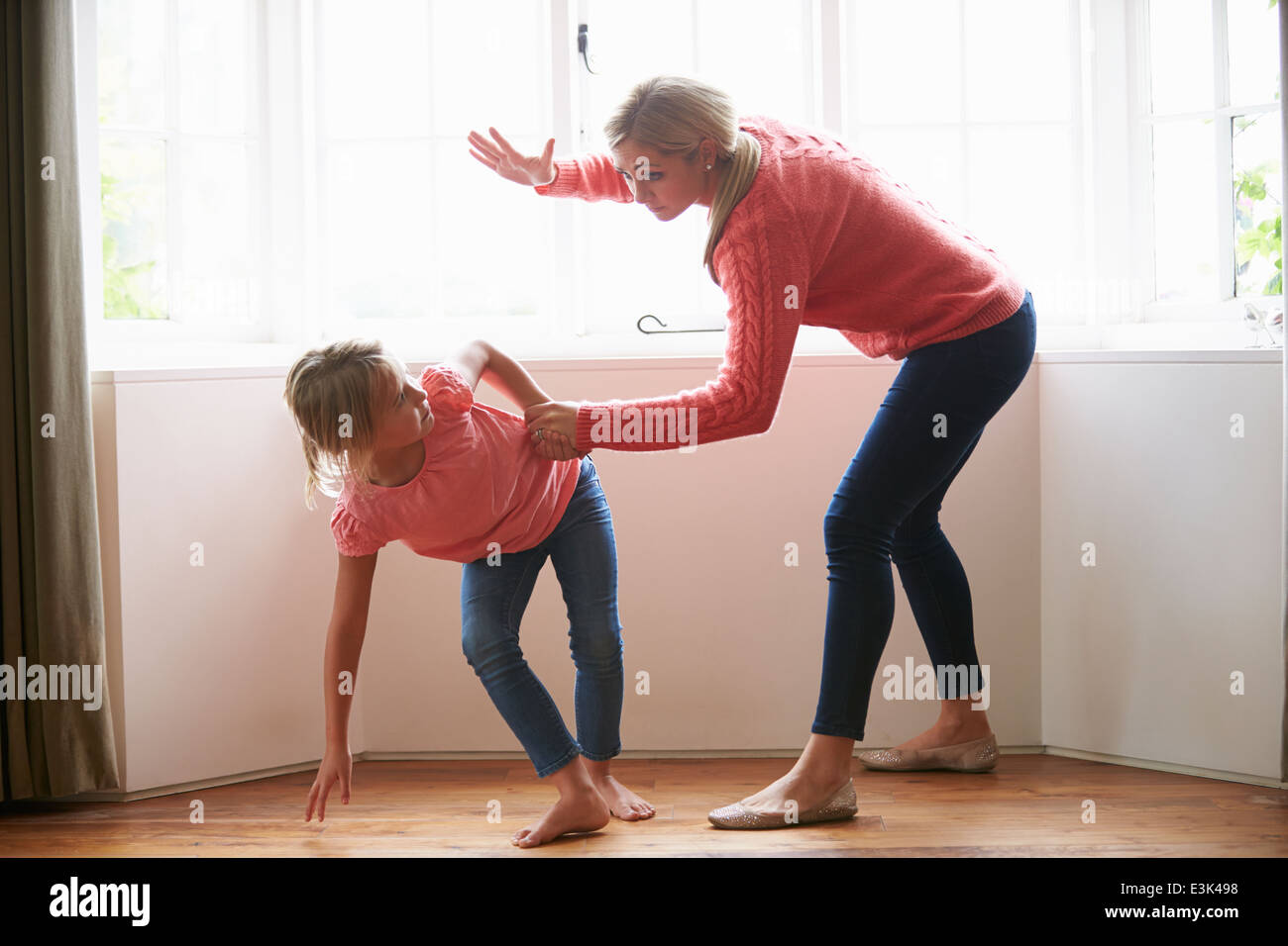 Mother Hitting Young Daughter Stock Photo