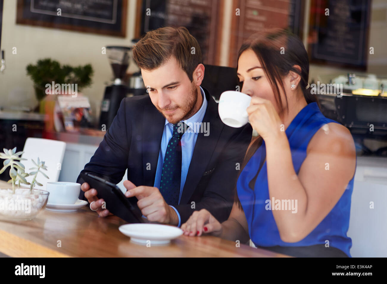 Businessman And Businesswoman Meeting In Coffee Shop Stock Photo - Alamy