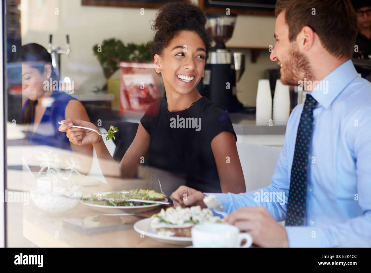 Two Businesspeople Meeting For Lunch In Coffee Shop Stock Photo Alamy