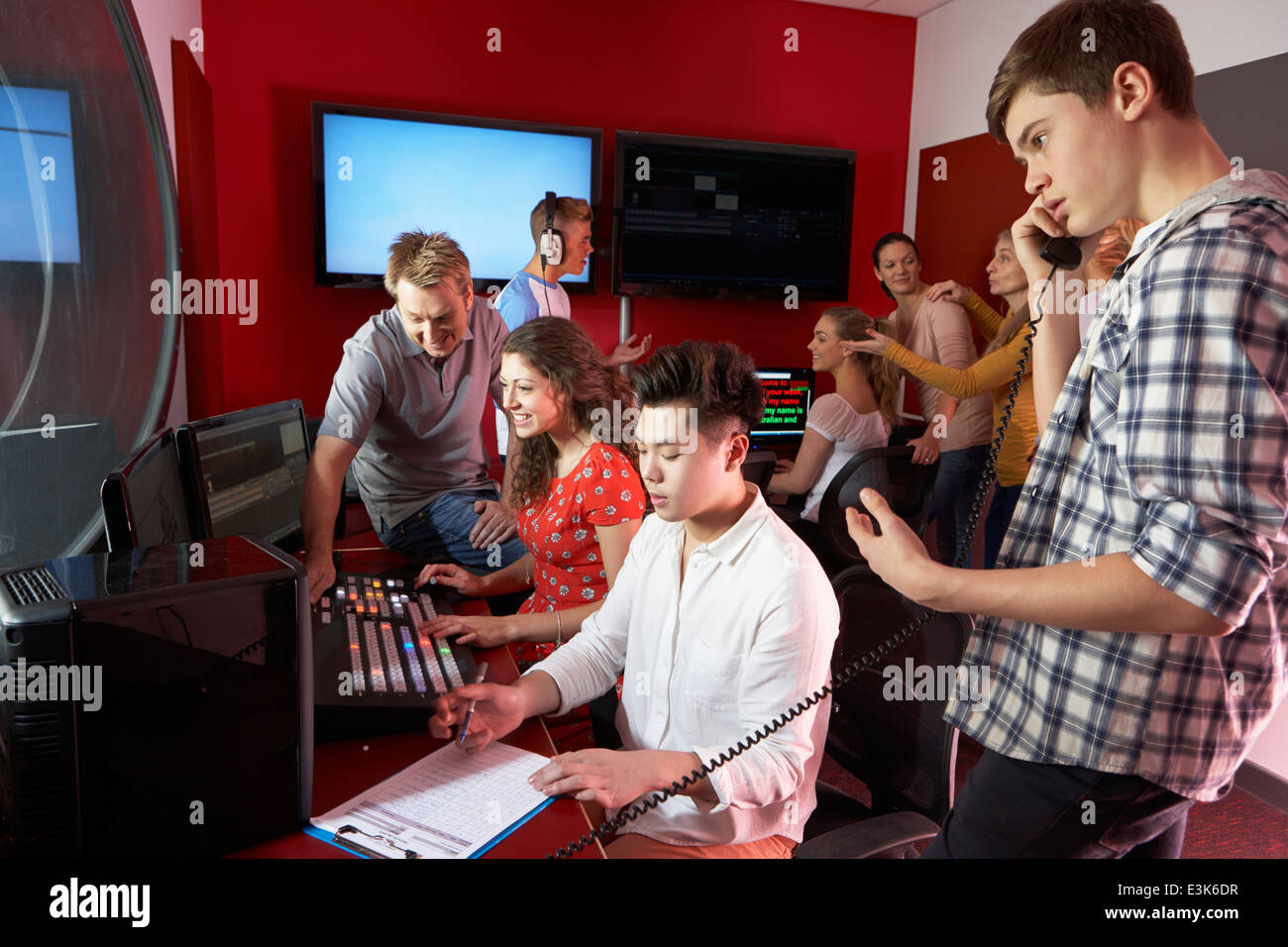 Group Of Media Students Working In Film Editing Class Stock Photo