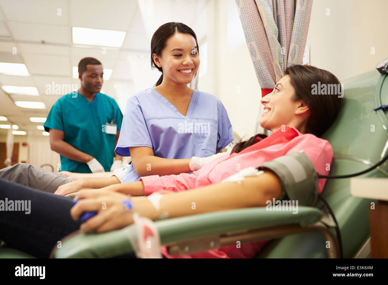 Blood Donors Making Donation In Hospital Stock Photo