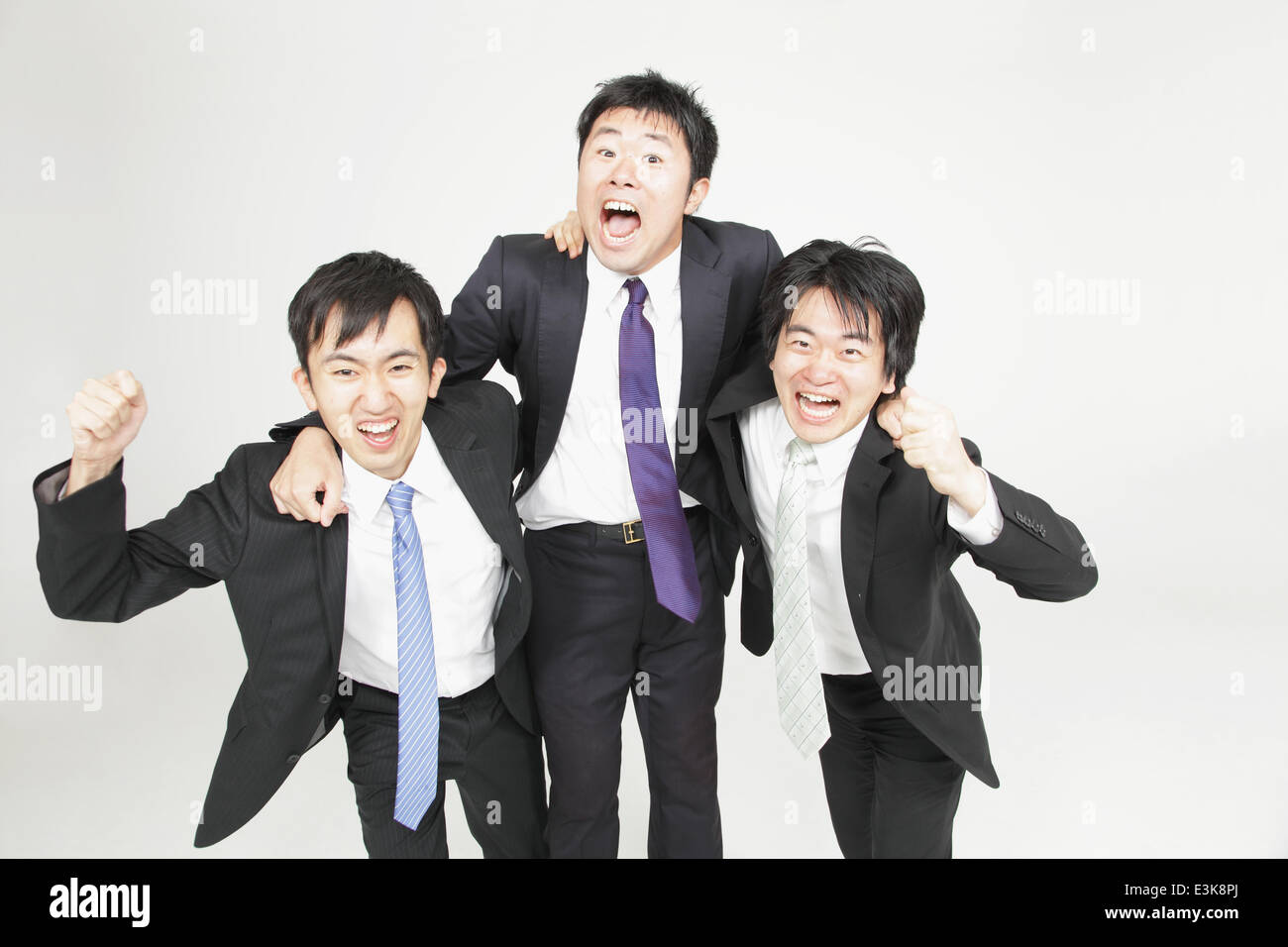 Japanese businessmen cheering Stock Photo Alamy