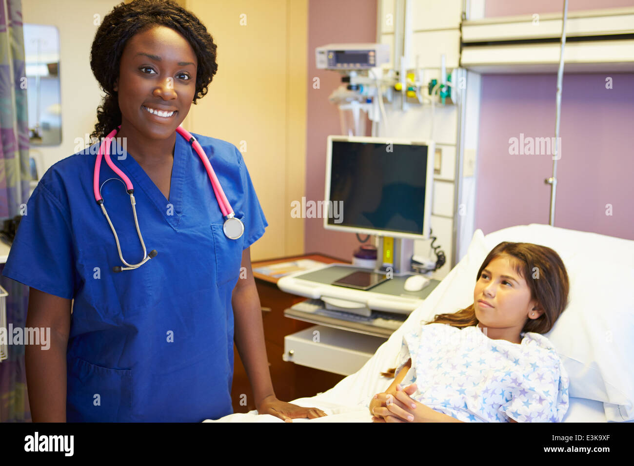 Portrait young nurse in scrubs hi-res stock photography and images - Alamy
