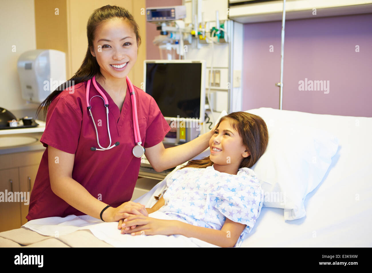 Young Girl Talking To Female Nurse In Hospital Room Stock Photo - Alamy