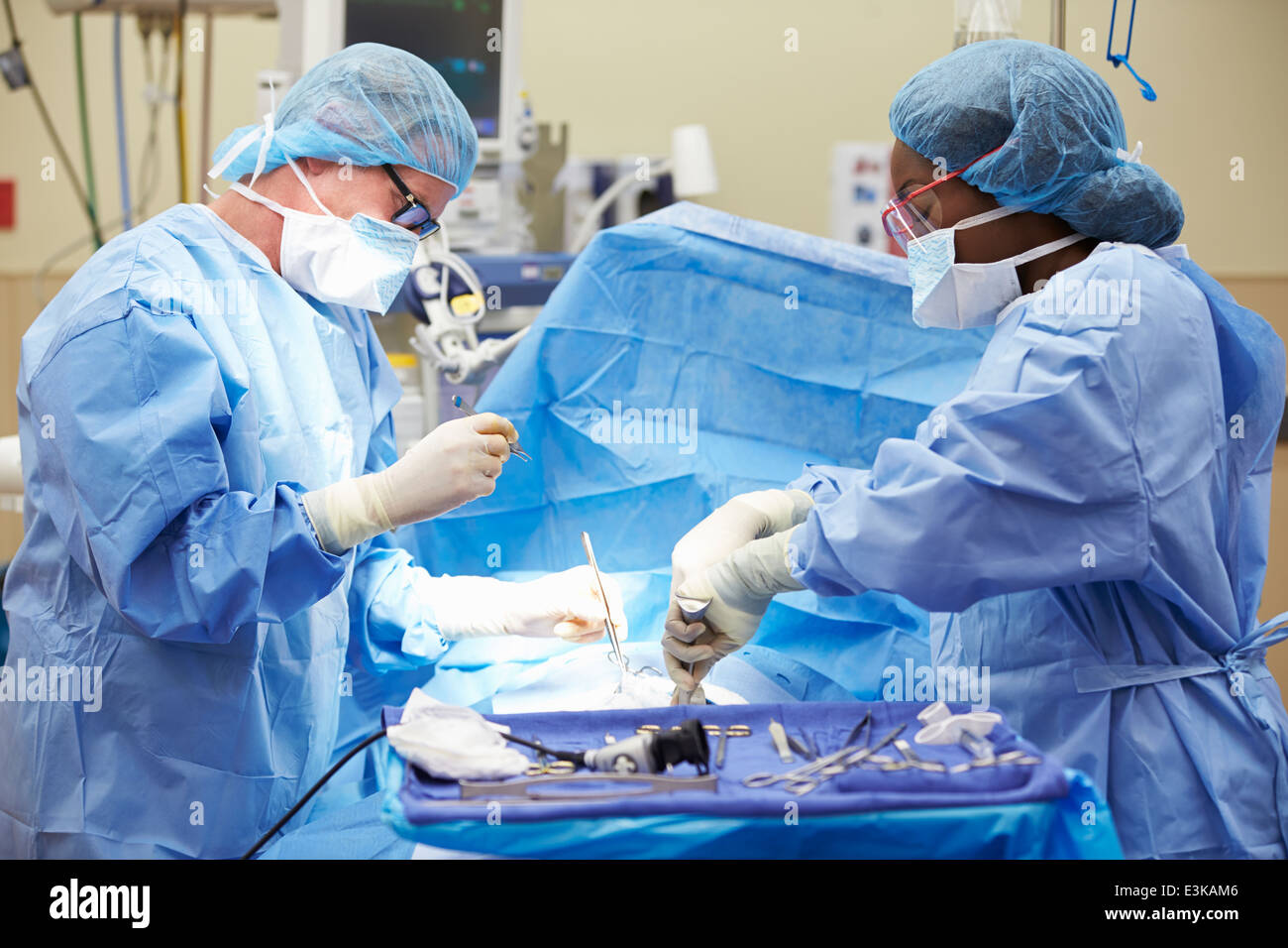 Surgical Team Working In Operating Theatre Stock Photo