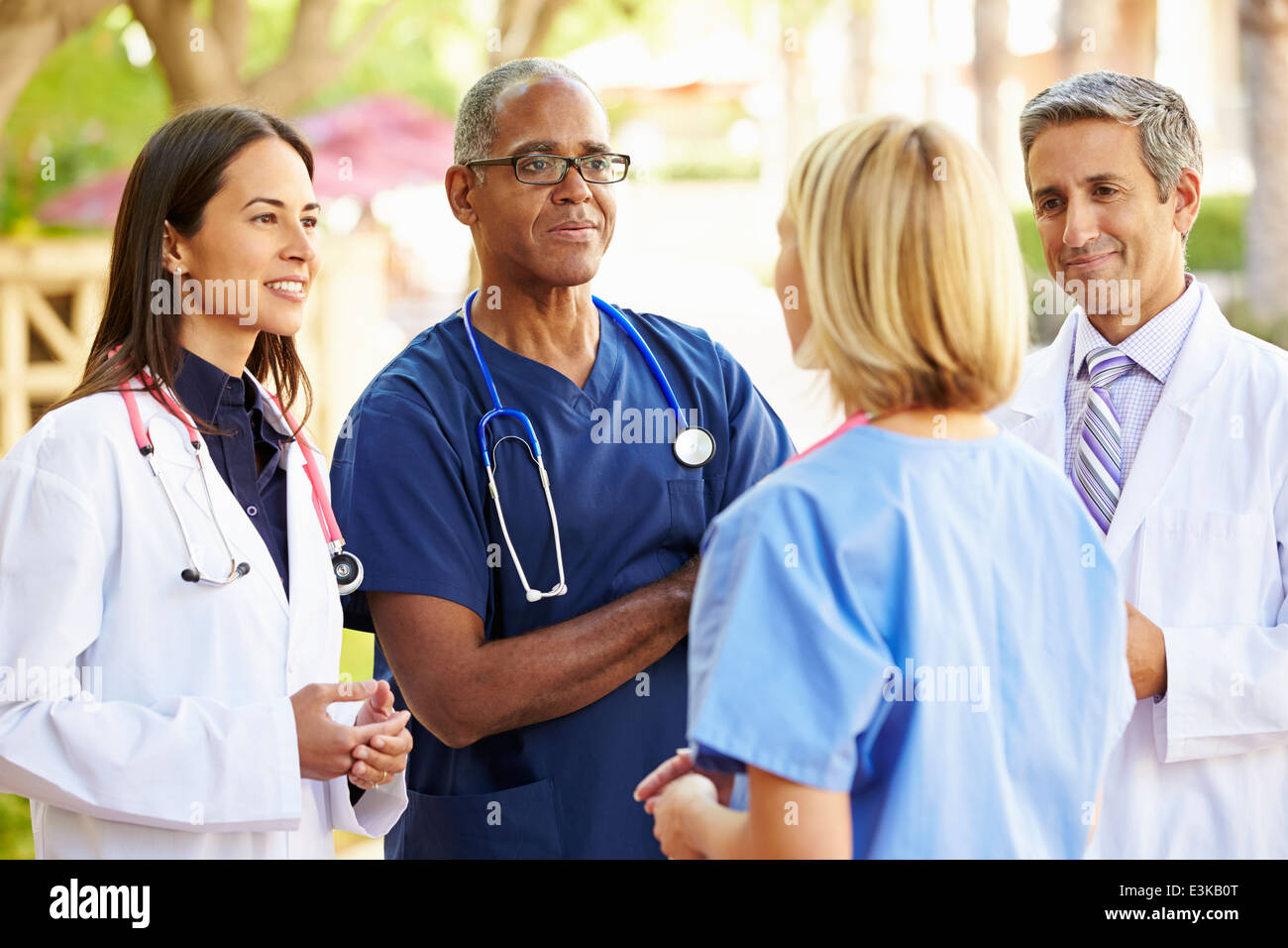 Medical Team Having Discussion Outdoors Stock Photo