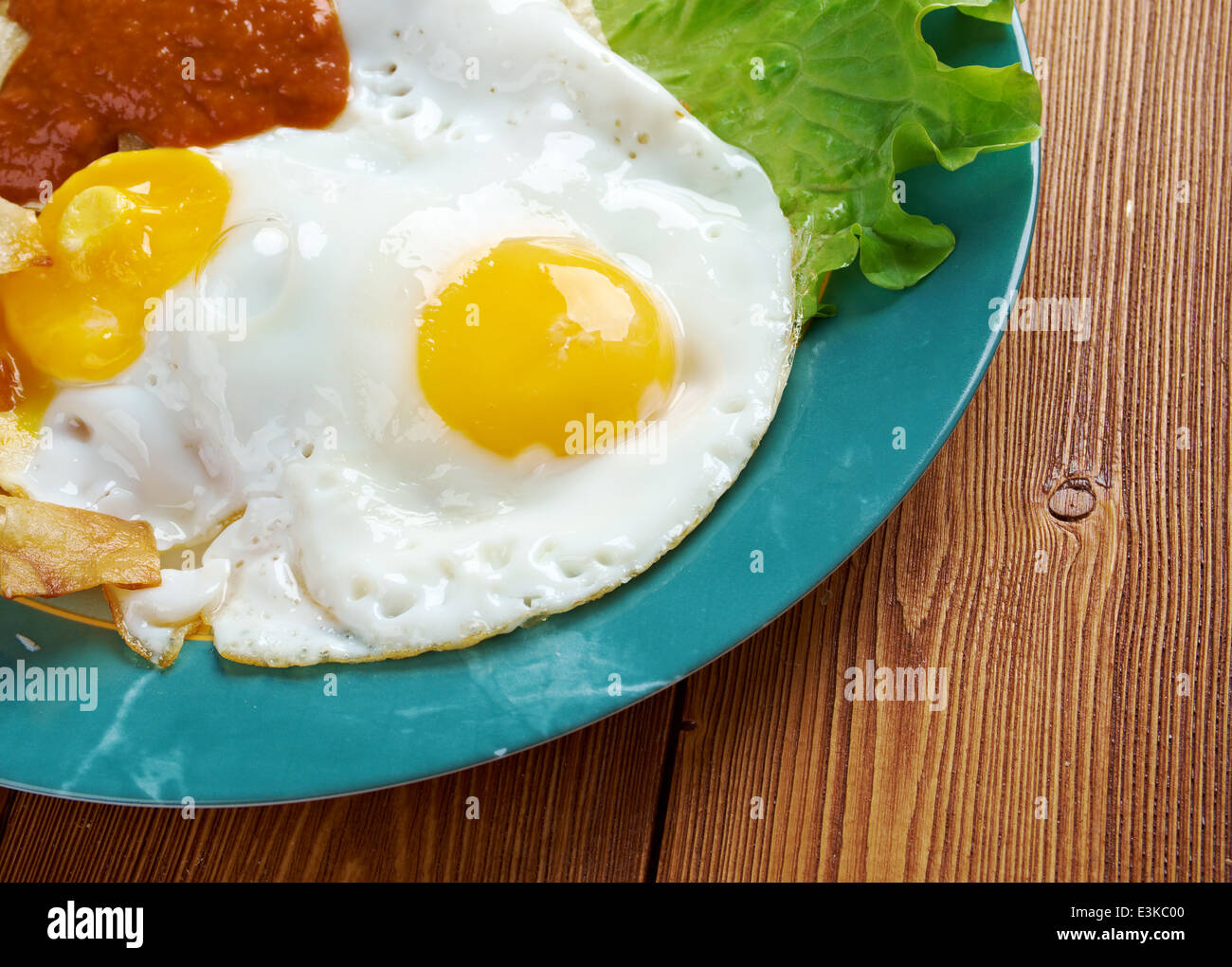 Huevos con chilaquiles Mexican traditional breakfast eggs. Eggs with