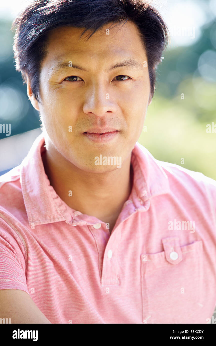 Portrait Of Asian Man In Countryside Stock Photo