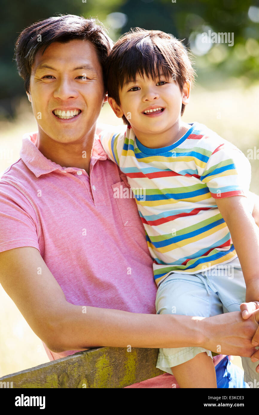 Portrait Of Asian Father And Son In Countryside Stock Photo