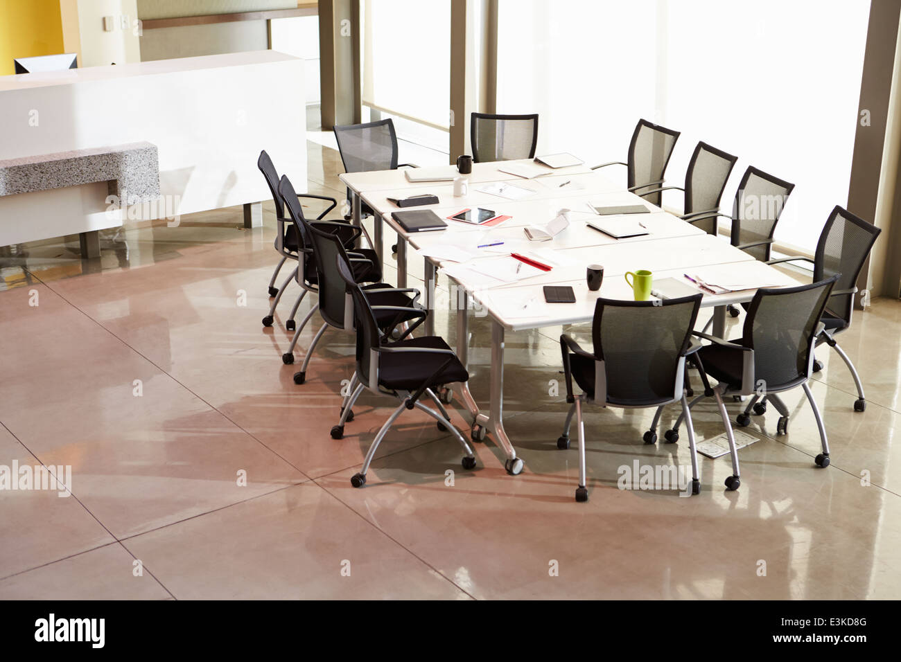Chairs Arranged Around Empty Boardroom Table Stock Photo