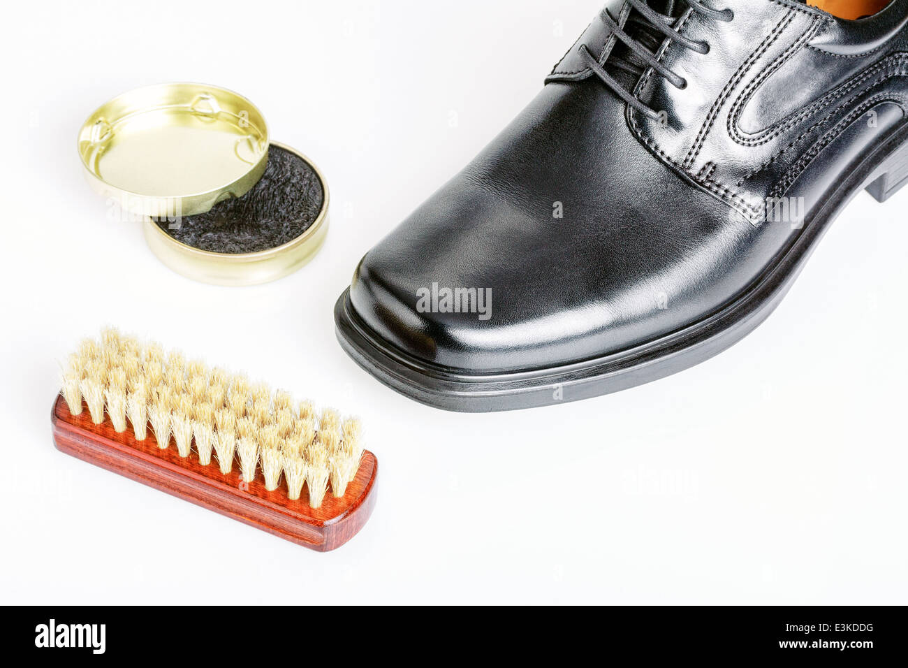 Classic shiny black men's shoe, boot polish and brush Stock Photo