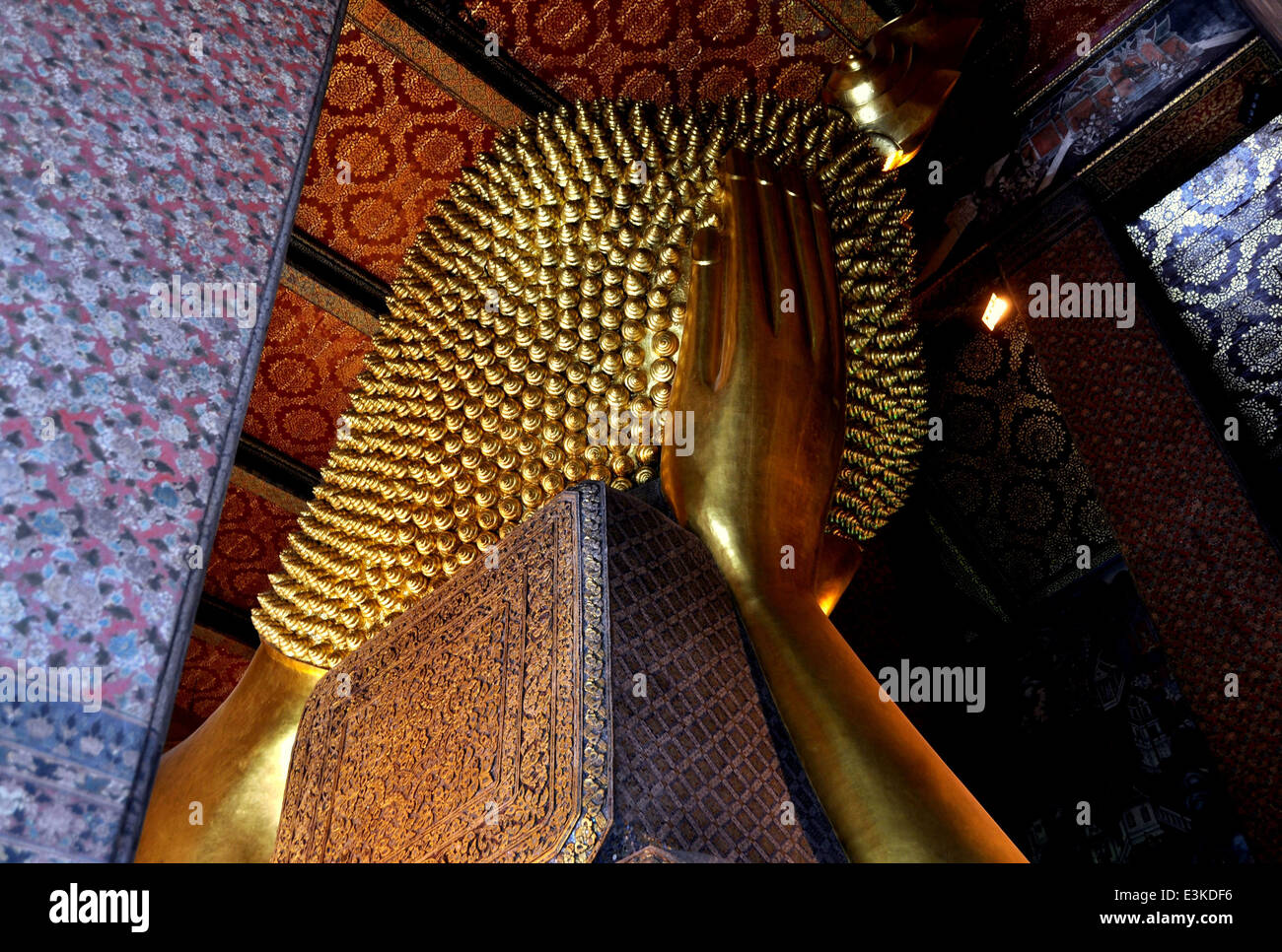 BANGKOK, THAILAND: Head of the great golden Reclining Buddha reaching Nirvana at Wat Pho Stock Photo