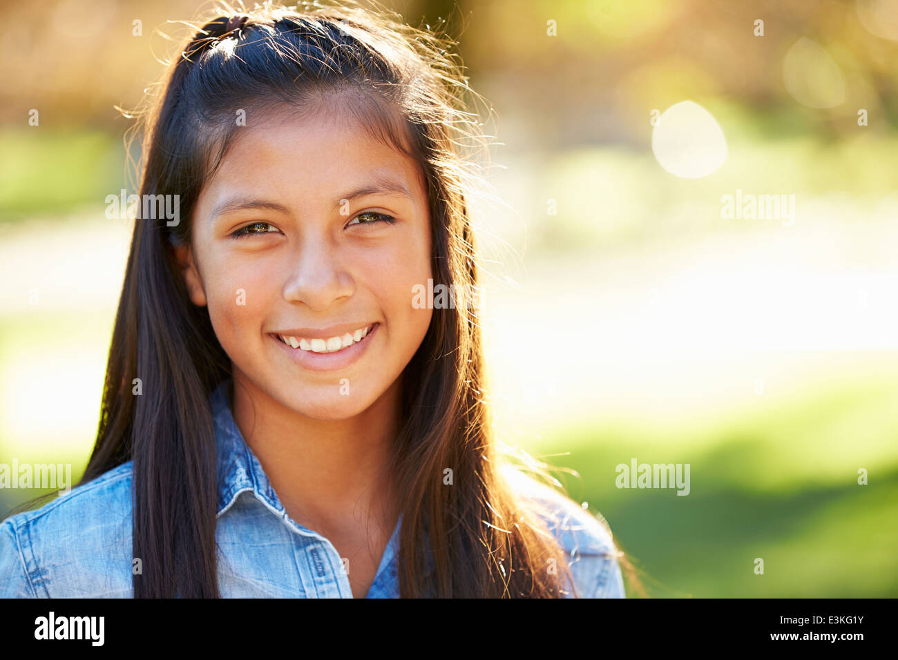 Portrait Of Hispanic Girl In Countryside Stock Photo