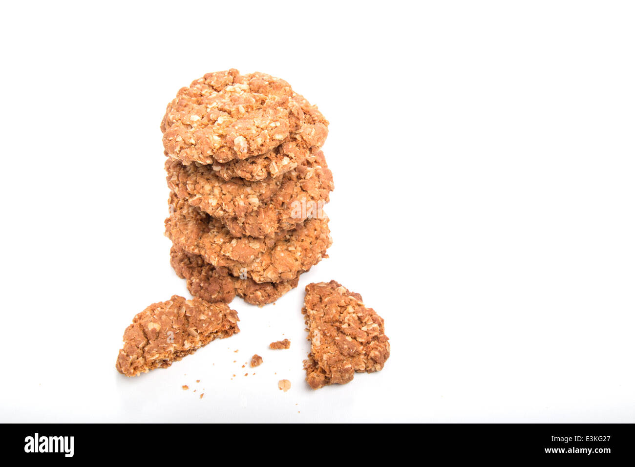 crunchy oat cookies/biscuits in a  stack on a pale background  [Pt] (13 of 16) Stock Photo