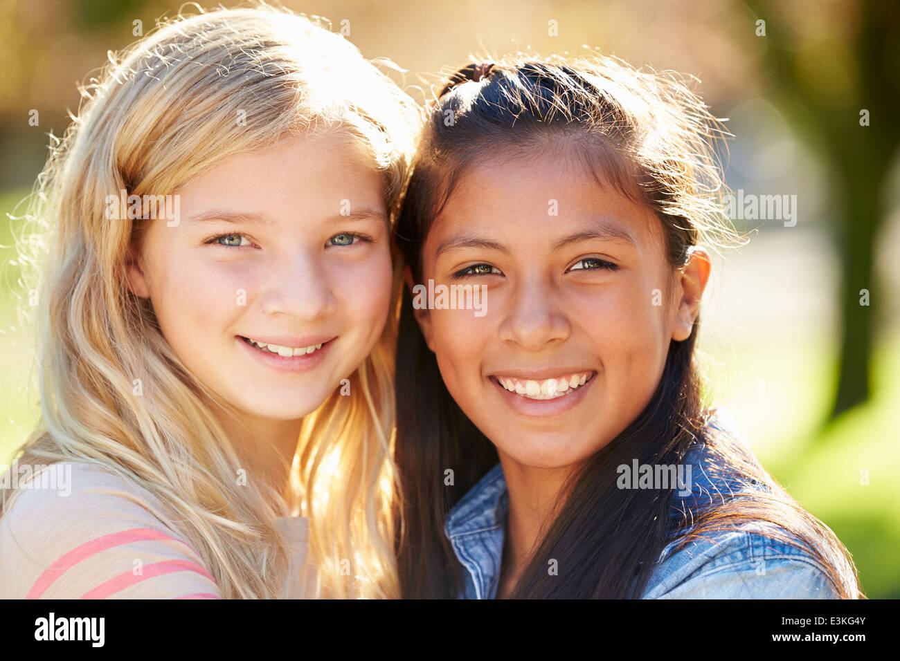 Portrait Of Two Pretty Girls In Countryside Stock Photo