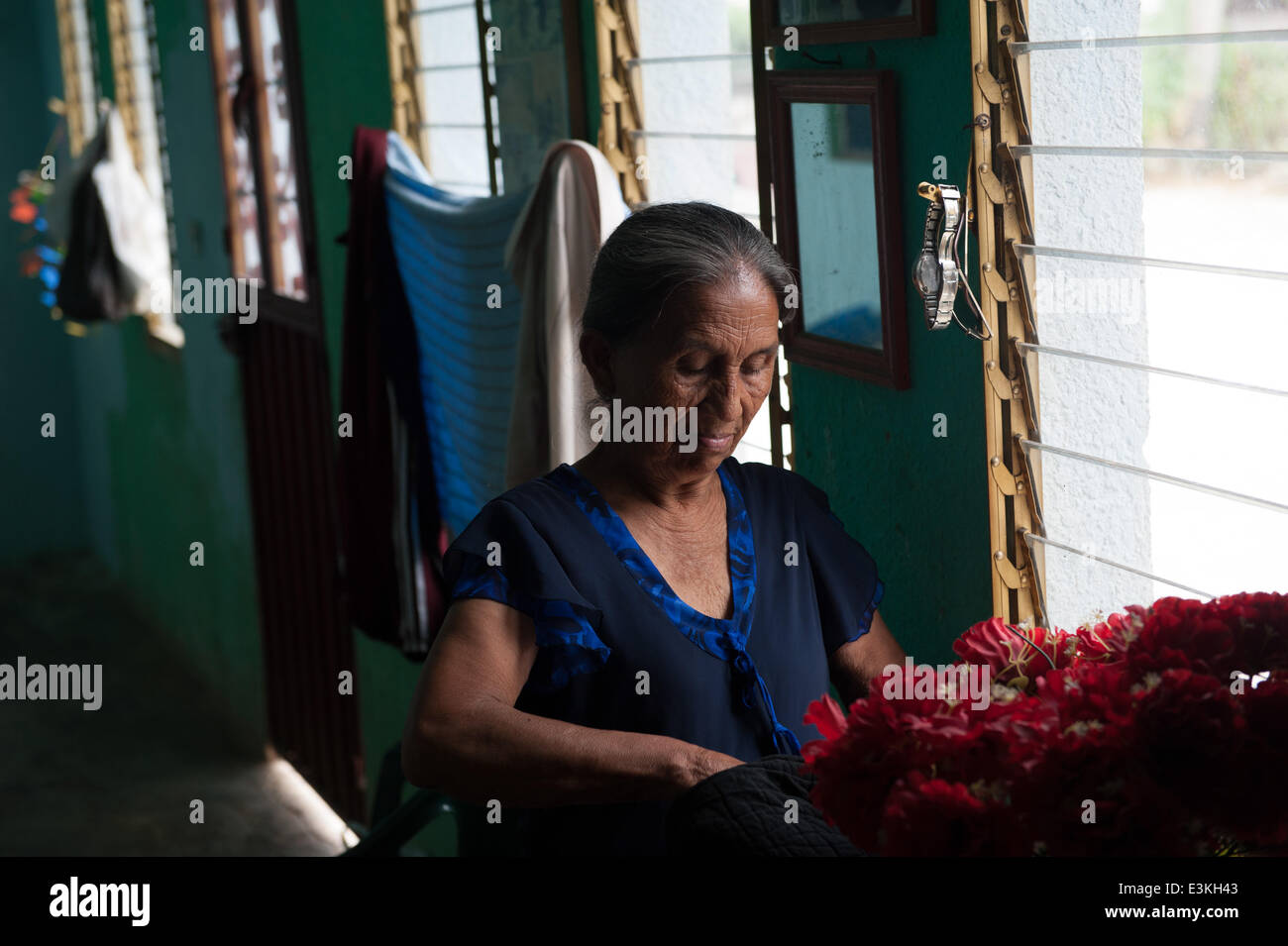 Sept. 29, 2013 - Salvador Urbina, Chiapas, Mexico - LUCIA MENDEZ SICARA stands in her house in Salvador Urbina, Chiapas, Mex.Coffee cooperatives in Chiapas, Mex. provide economic opportunity in a financially depressed area, giving would-be undocumented immigrants a reason to stay in Mexico. (Credit Image: © Will Seberger/ZUMAPRESS.com) Stock Photo