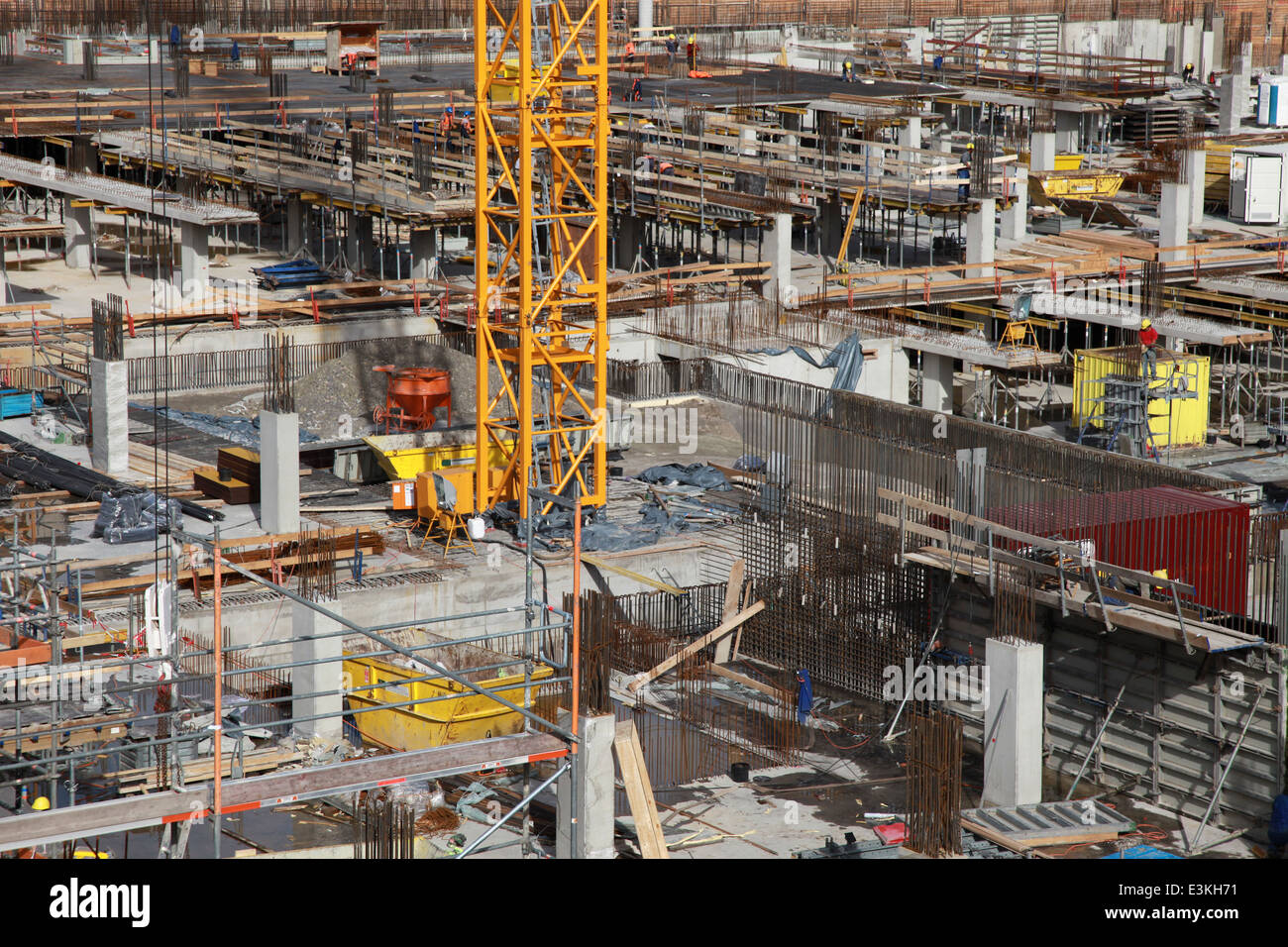 Concrete building under construction with a crane Stock Photo - Alamy
