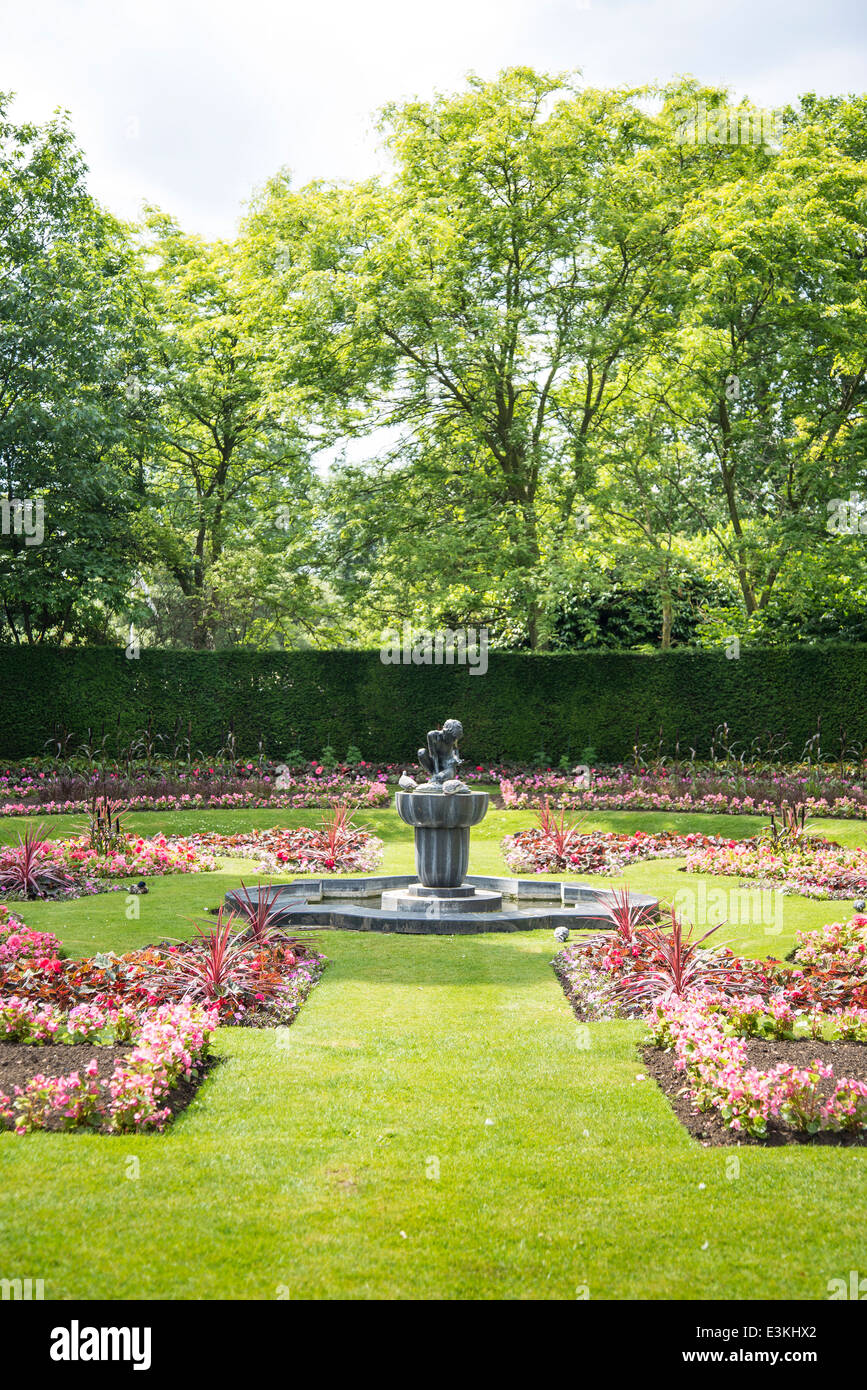 Formal garden with a water fountain statue, Regents Park, London, England, UK Stock Photo