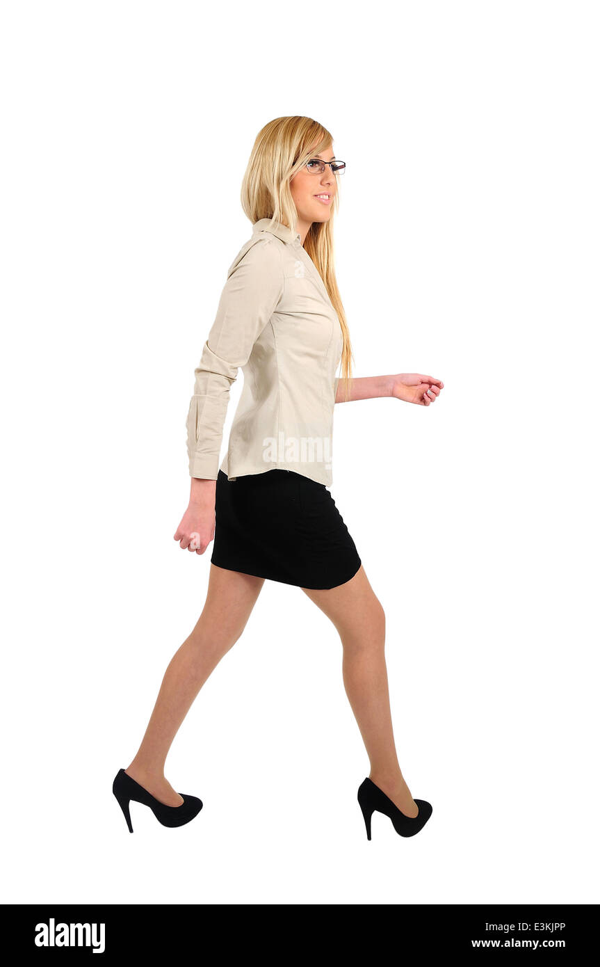 Isolated young business woman walking Stock Photo - Alamy