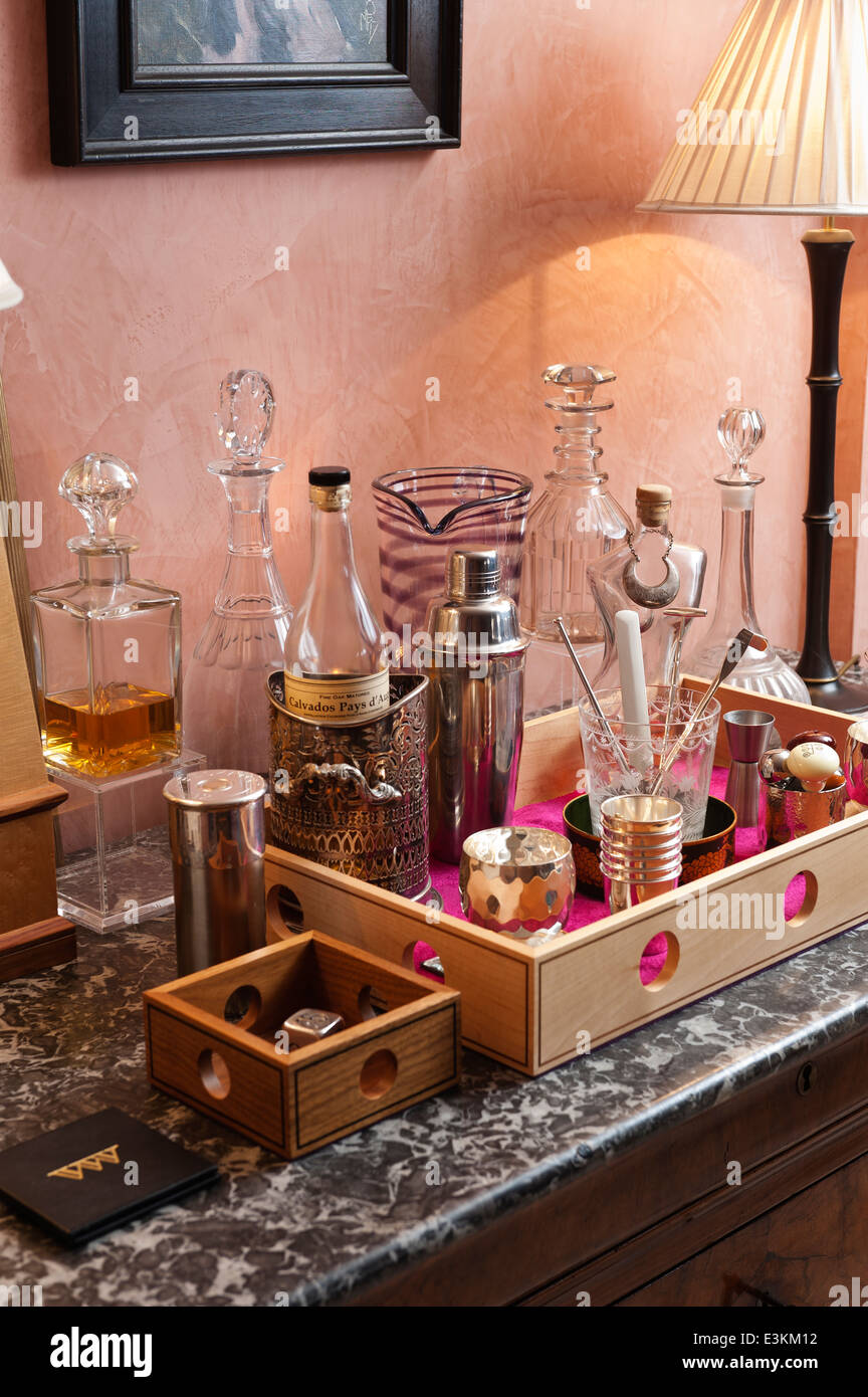 Glass decanters and cocktail mixer in a wooden drinks tray designed by Beckford Stock Photo