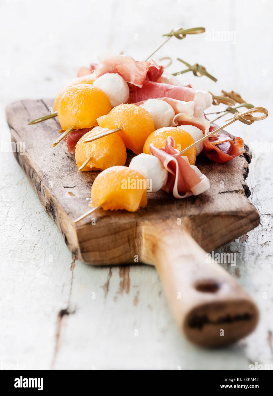 Mozzarella, prosciutto, melon canapes on textured background Stock Photo Alamy