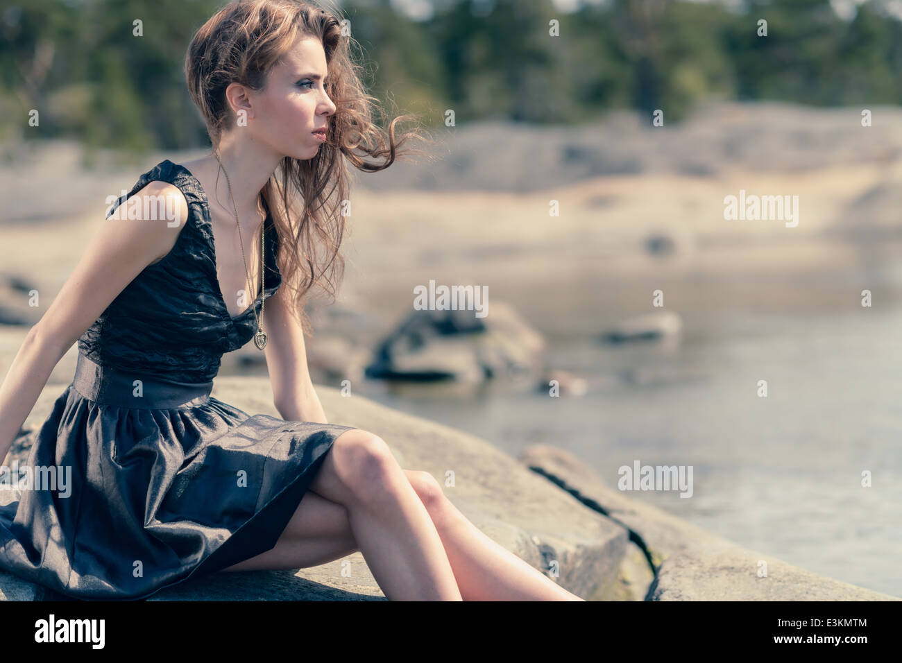 Woman sits on rock hi-res stock photography and images - Alamy