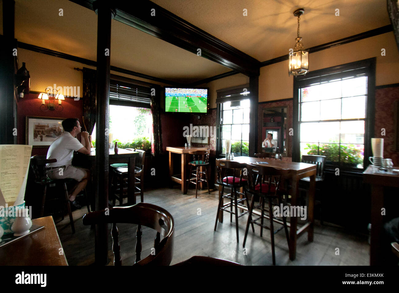 Wimbledon, London, UK. 24th June 2014. The England v Costa Rica world cup match  is televised in an empty  pub after England was eliminated from the 2014 World Cup in Brazil Credit:  amer ghazzal/Alamy Live News Stock Photo