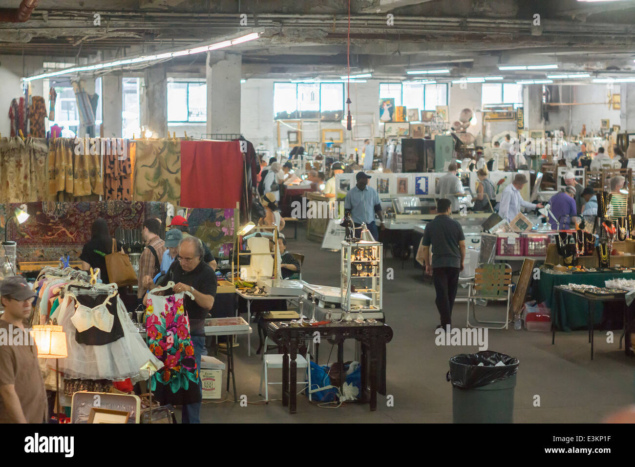Shoppers search for bargains at the Garage Flea Market in the New York neighborhood of Chelsea Stock Photo