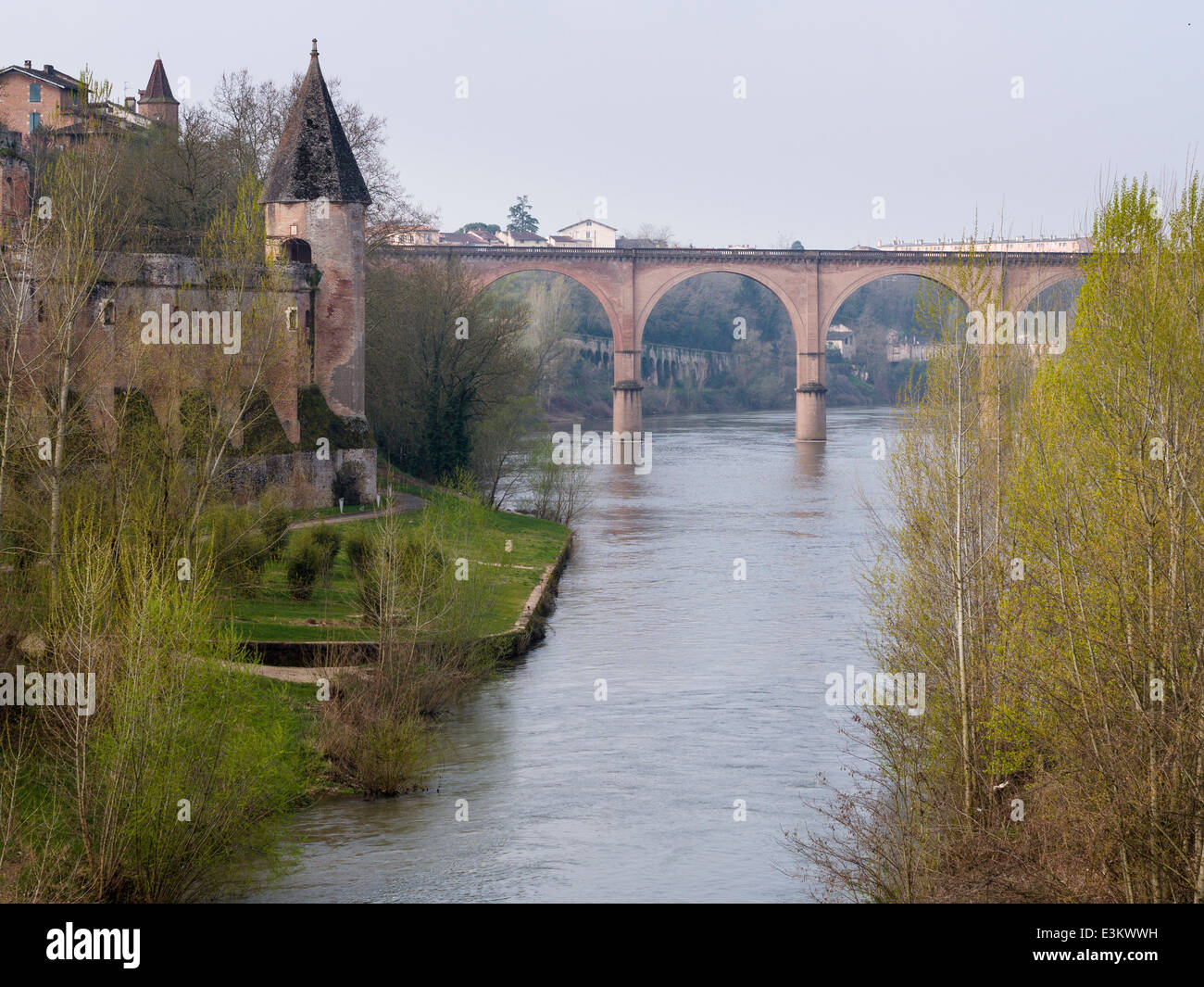 The Tarn River rail bridge and the Bishop's Palace. A springtime view up the Tarn river in the town of Albi. Stock Photo