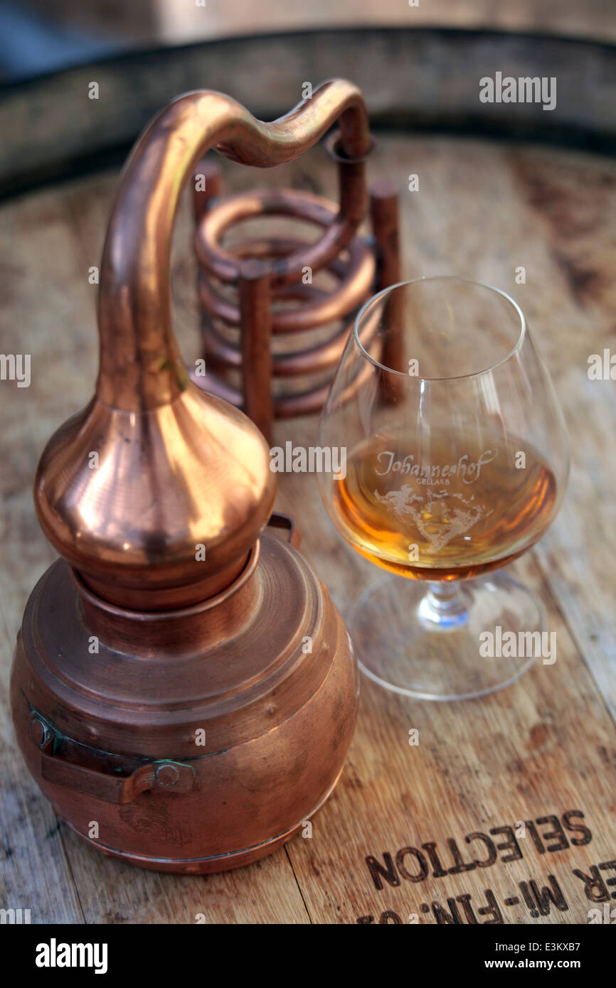 Brandy glass and a miniature still at Johanneshof distillery, near Picton, Marlborough, New
